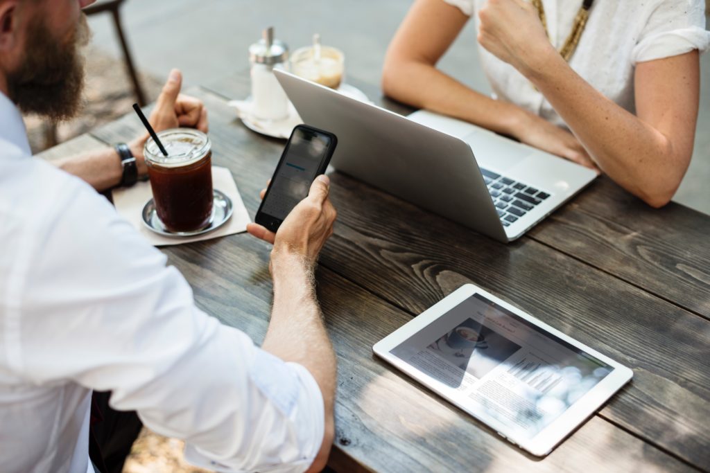 Creative meeting at a desk with a woman and man